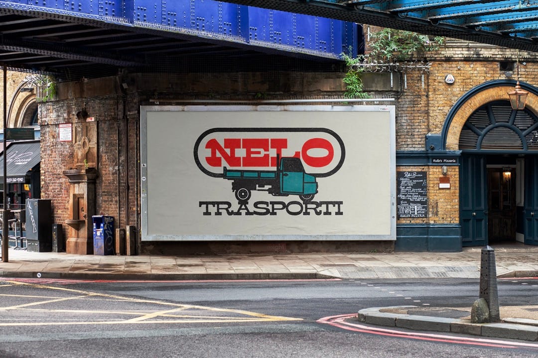 Nelo Trasporti billboard under a railway bridge showing the red logo and teal truck